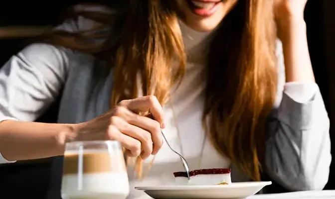 Diners seated in a busy restaurant whose table mix was optimized with process simulation